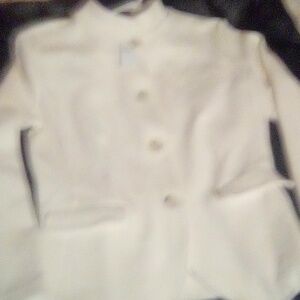 White jacket tag says 100.00$